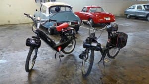 A French Solex motorcycles, and an e-Solex. The e-Solex uses a battery. 