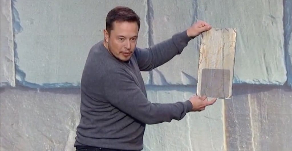 Elon Musk with his silica solar panels. 
